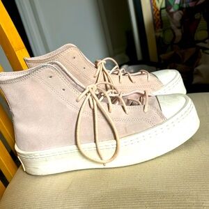 Light pink Converse with platform sole.
